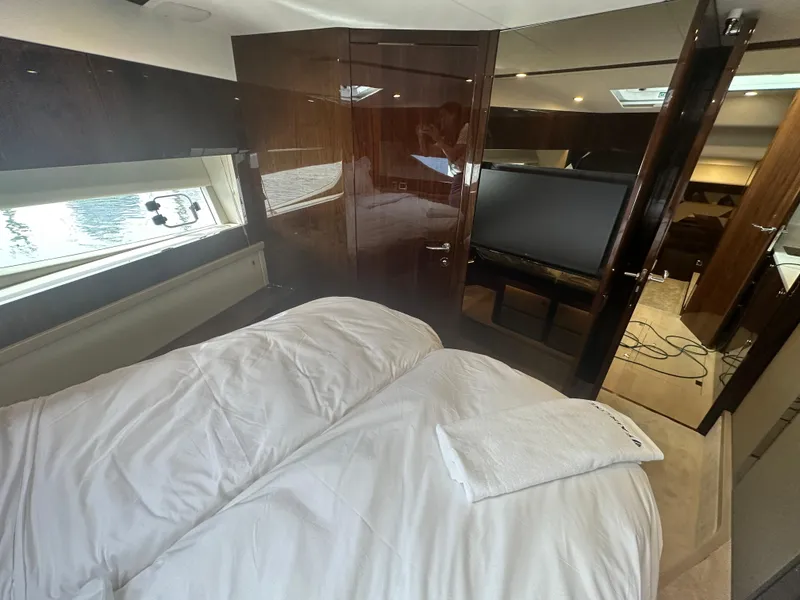 Slide: The Image of Luxurious bedroom interior of 2024 Fairline Targa 45 GT yacht with modern amenities. - 7