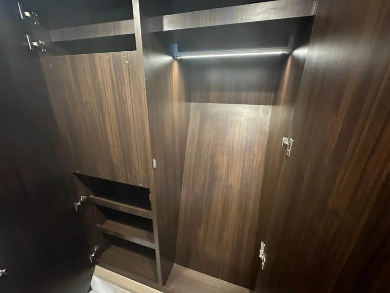 Slide: The Image of Spacious wooden closet interior in the 2024 Fairline Targa 45 GT yacht. - 8