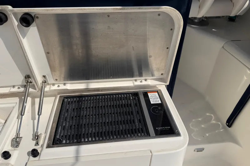 Slide: The Image of Outdoor grill on 2009 Pursuit OS 375 Offshore boat, featuring Kenyon electric cooktop. - 10