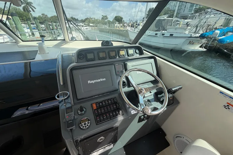 Slide: The Image of Helm of 2009 Pursuit OS 375 Offshore boat with Raymarine navigation system. - 15