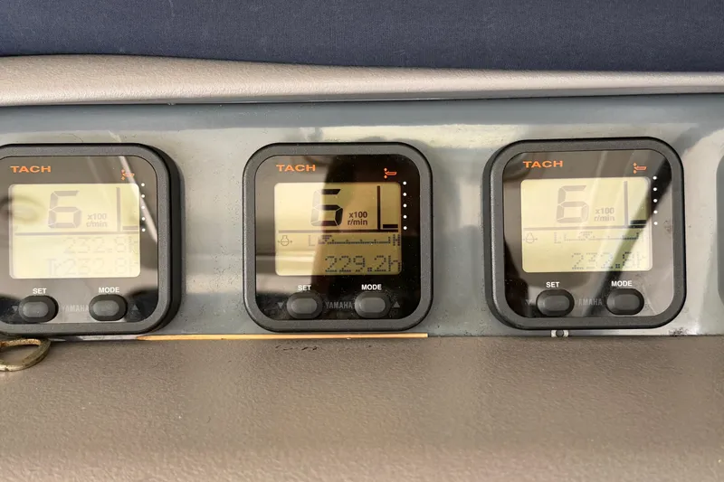 Slide: The Image of Tachometer displays on 2009 Pursuit OS 375 Offshore boat dashboard. - 23