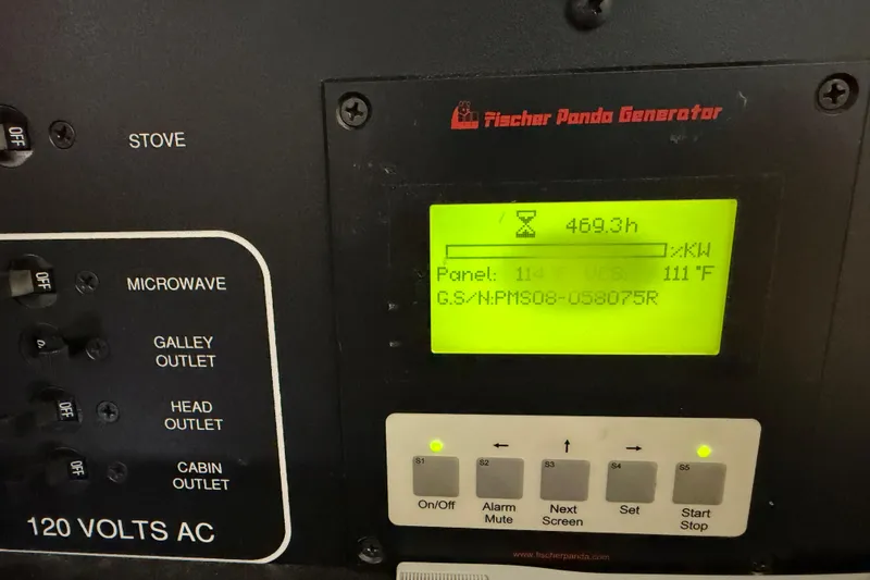 Slide: The Image of Control panel of a 2009 Pursuit OS 375 Offshore with Fischer Panda generator display. - 25