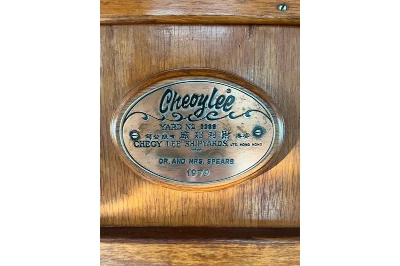 Slide: The Image of Plaque on 1979 Cheoy Lee Sedan 35, featuring shipyard details and owner's name. - 11