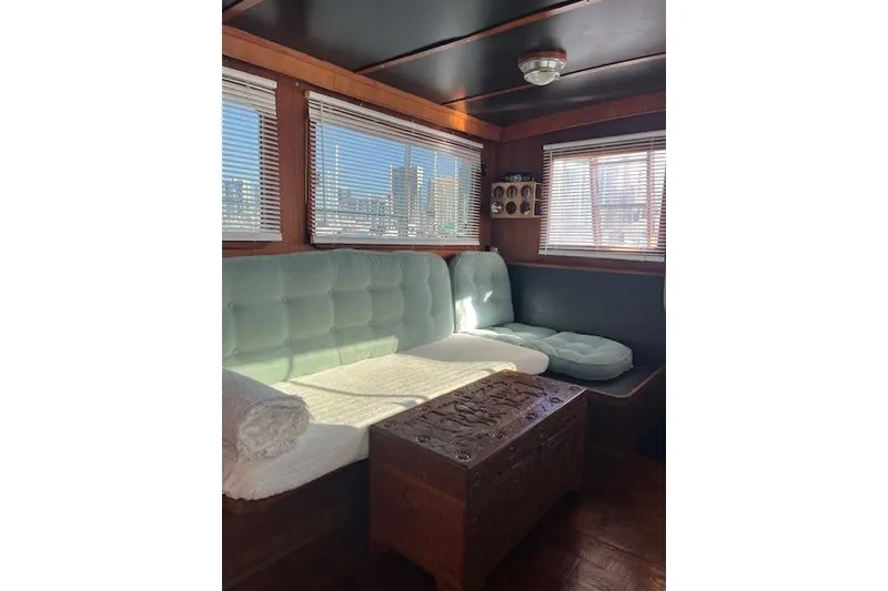 Slide: The Image of Interior of 1979 Cheoy Lee Sedan 35 with cozy seating and wooden accents. - 8