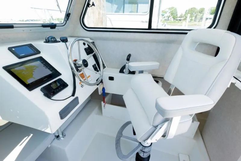Slide: The Image of Manufacturer Provided Image: Interior helm of 2022 Parker 2320 Sport Cabin with modern navigation equipment. - 6