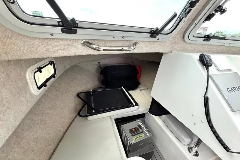 Slide: The Image of Interior of 2022 Parker 2320 Sport Cabin with Garmin equipment and seating area. - 9