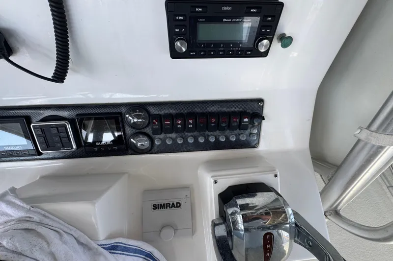 Slide: The Image of 2006 Twin Vee 36 Center Console dashboard with controls and navigation equipment. - 10