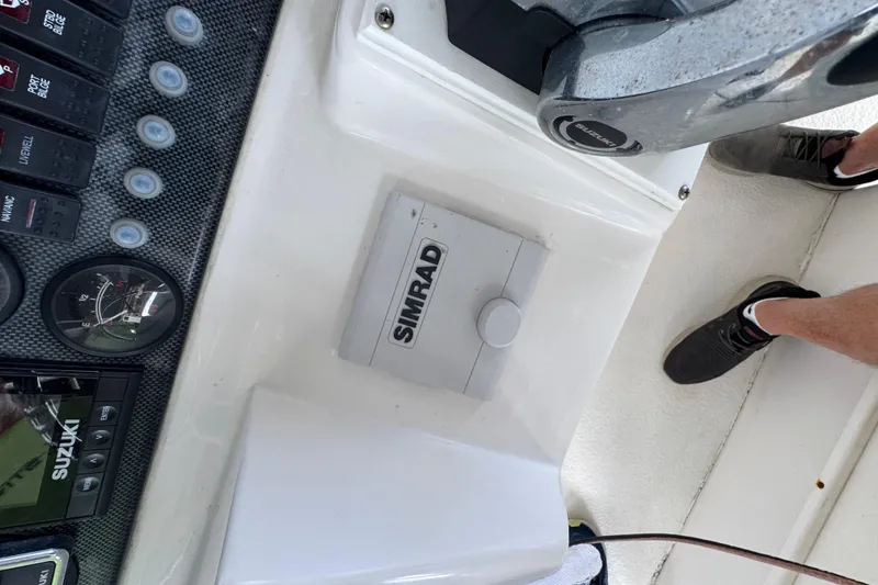 Slide: The Image of Console of 2006 Twin Vee 36 Center Console with Simrad equipment and controls. - 11