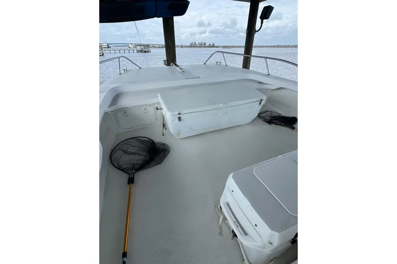 Slide: The Image of 2006 Twin Vee 36 Center Console boat deck with fishing nets and storage compartments. - 7