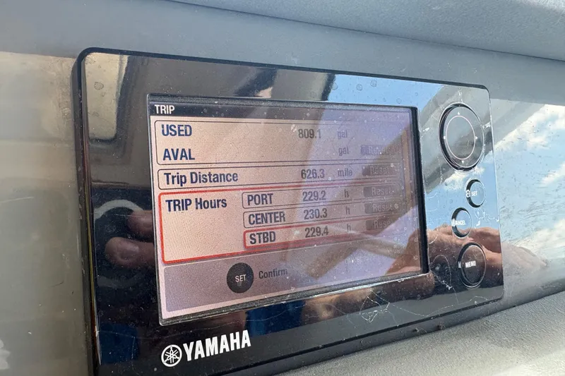 Slide: The Image of Yamaha display showing trip data on a 2011 Pursuit OS 375 Offshore boat. - 33