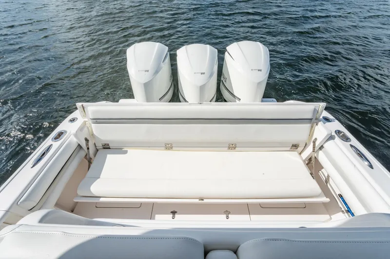 Slide: The Image of 2015 Intrepid 375 Center Console boat with triple outboard engines on water. - 7