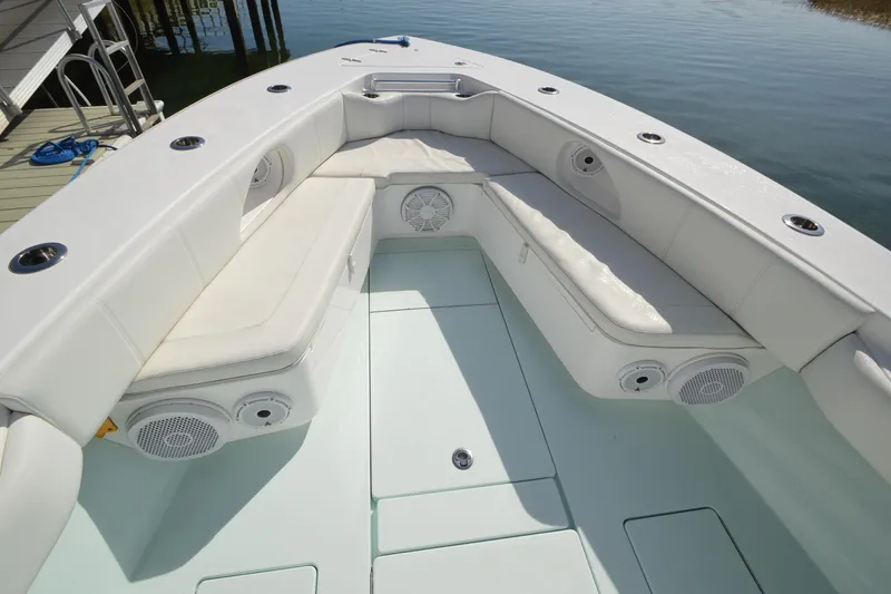 Slide: The Image of 2015 Contender 32 ST boat interior with cushioned seating and built-in speakers. - 1