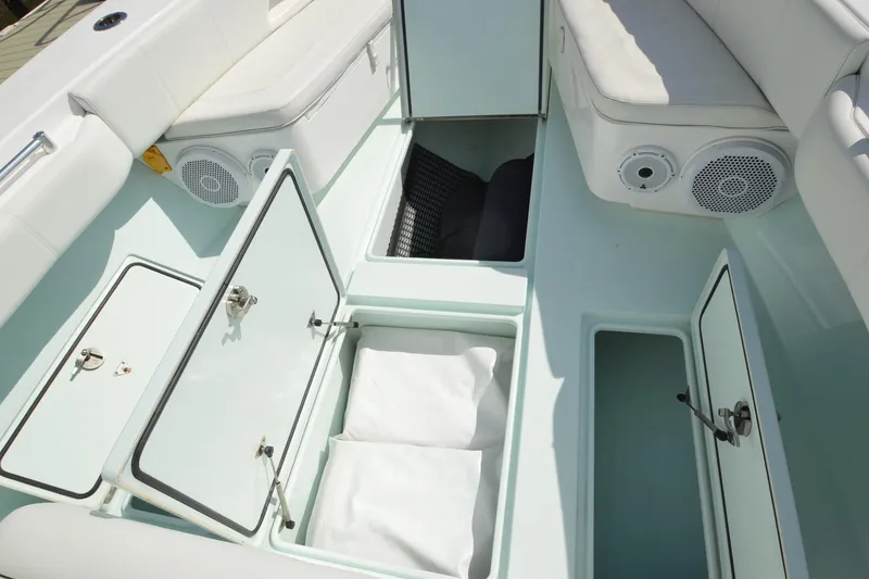 Slide: The Image of 2015 Contender 32 ST boat interior with open storage compartments and seating. - 18