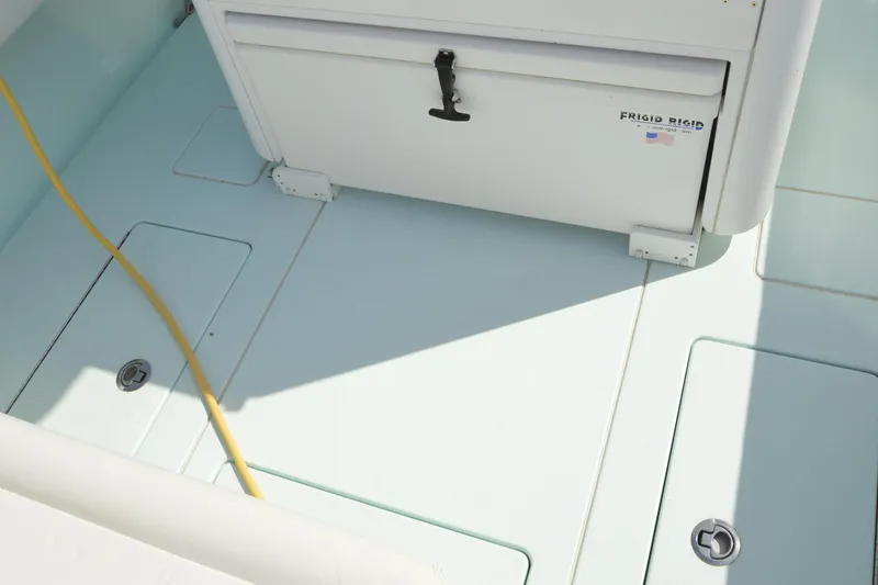 Slide: The Image of 2015 Contender 32 ST boat deck with storage compartments and cooler. - 28