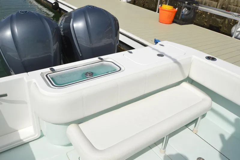 Slide: The Image of 2015 Contender 32 ST boat with twin engines and seating at dock. - 30
