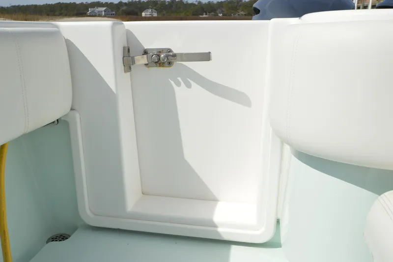 Slide: The Image of 2015 Contender 32 ST boat interior with white seating and latch detail. - 31