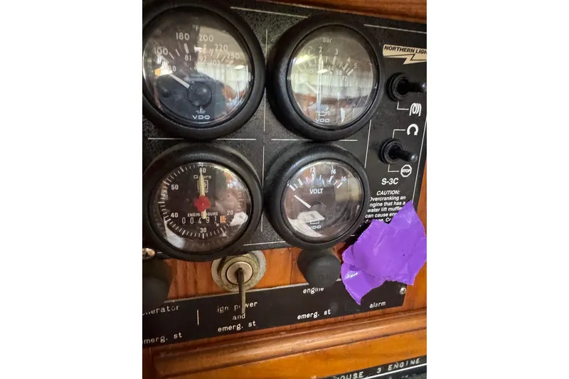 Slide: The Image of Close-up of 1981 Bristol 41.1 Aft Cockpit boat instrument panel with gauges and switches. - 12