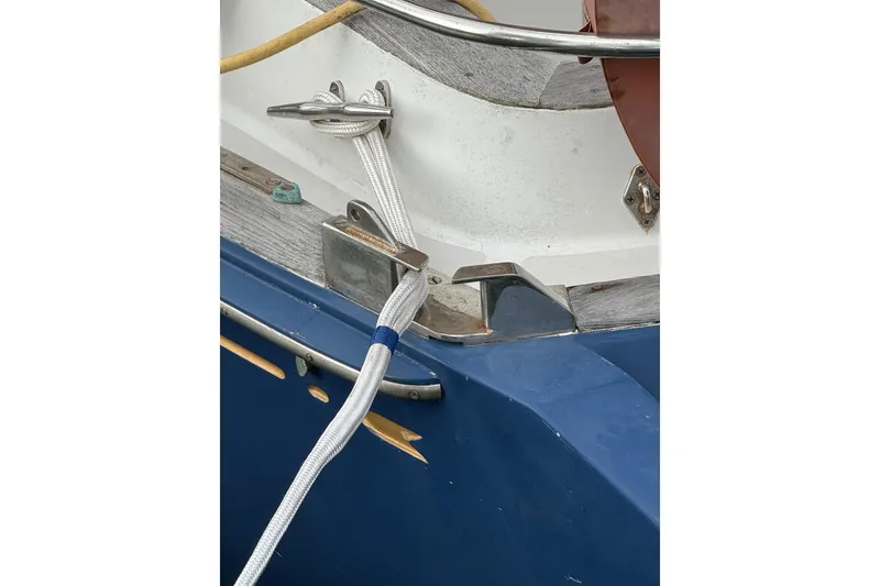 Slide: The Image of Close-up of a 1981 Bristol 41.1 Aft Cockpit boat's cleat with rope. - 2
