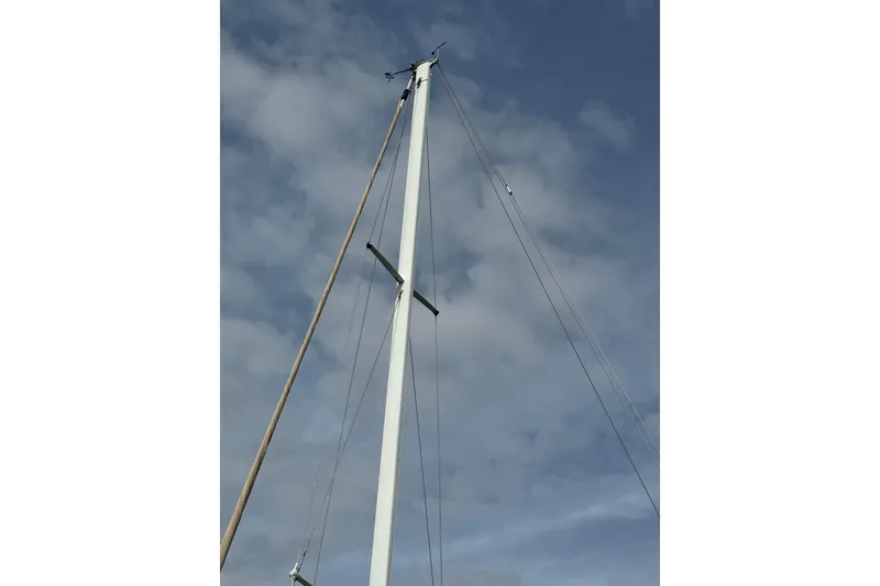 Slide: The Image of Mast of 1981 Bristol 41.1 Aft Cockpit sailboat against cloudy sky. - 8