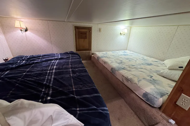 Slide: The Image of Cozy bedroom in 1993 Gibson 44 Cabin Yacht with twin beds and wall lamps. - 39