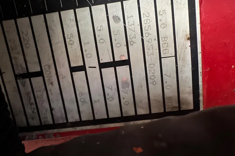 Slide: The Image of Control panel of a 1993 Gibson 44 Cabin Yacht with labeled switches and numbers. - 51