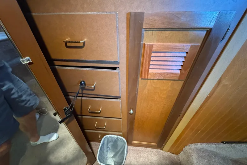 Slide: The Image of Interior of 1993 Gibson 44 Cabin Yacht with wooden drawers and door. - 40