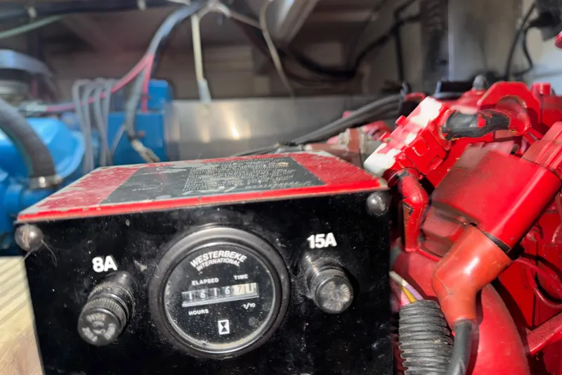 Slide: The Image of Engine compartment of 1993 Gibson 44 Cabin Yacht with Westerbeke generator. - 49