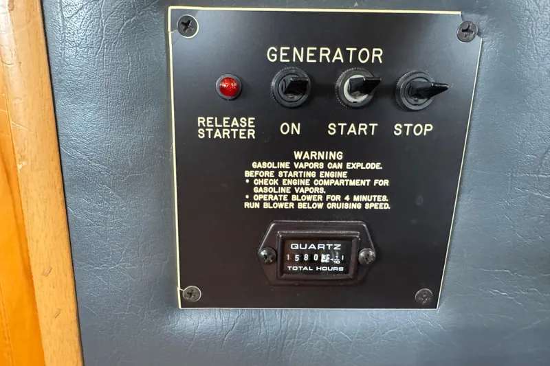 Slide: The Image of Generator control panel on 1993 Gibson 44 Cabin Yacht with warning instructions. - 15