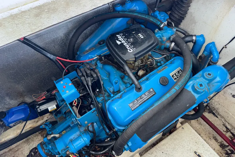 Slide: The Image of Engine of 1993 Gibson 44 Cabin Yacht, featuring a blue Crusader Marine motor. - 45