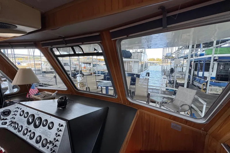Slide: The Image of Interior view of 1993 Gibson 44 Cabin Yacht with marina in background. - 35