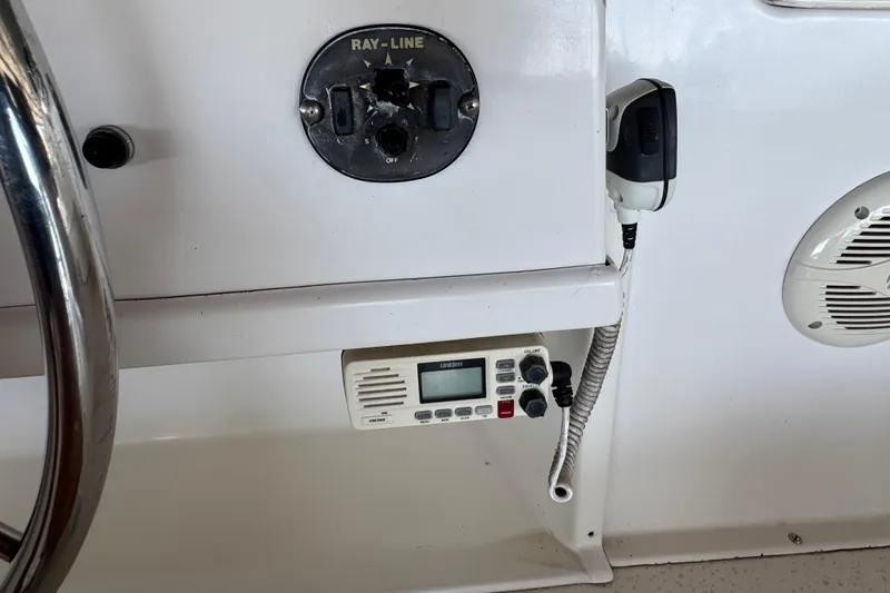 Slide: The Image of Control panel of a 1993 Gibson 44 Cabin Yacht with radio and steering wheel. - 61