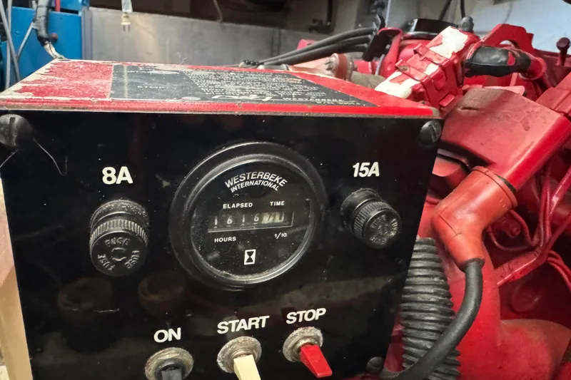 Slide: The Image of Control panel of a 1993 Gibson 44 Cabin Yacht engine, featuring Westerbeke elapsed time gauge. - 50