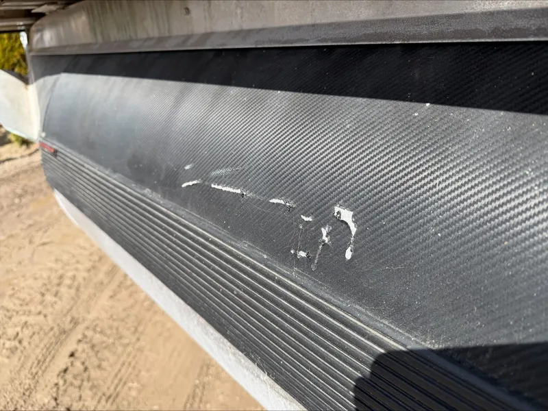 Slide: The Image of Close-up of damaged Starcraft SLS 3 boat hull, 2023 model. - 16