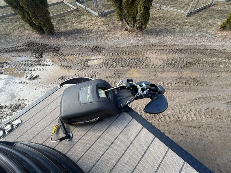 Slide: The Image of Starcraft SLS 3 2023 with Minn Kota motor on muddy terrain. - 19