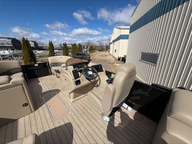 Slide: The Image of Interior of a 2023 Starcraft SLS 3 pontoon boat with beige seating. - 38