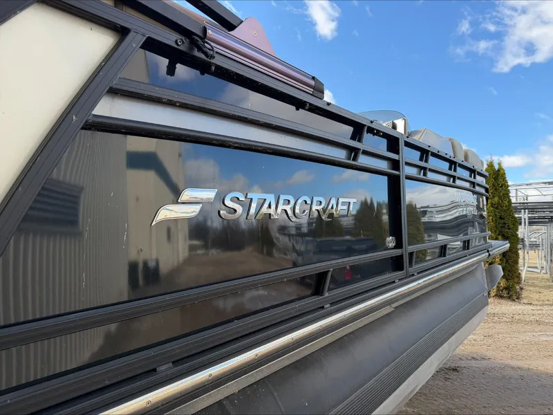 Slide: The Image of Starcraft SLS 3 boat 2023, side view with logo and blue sky. - 5