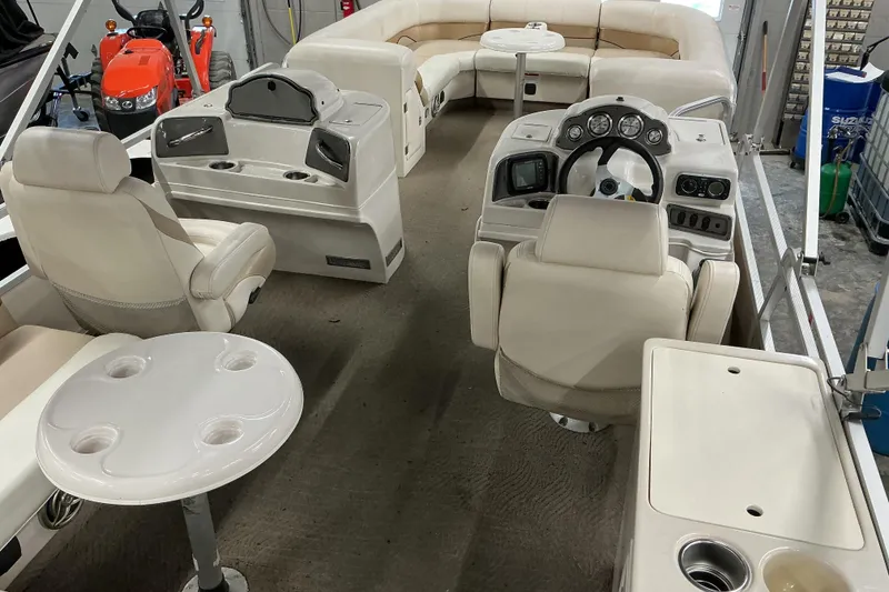 Slide: The Image of Interior of 2008 SunCatcher LX3 26 DC pontoon boat with seating and steering console. - 5