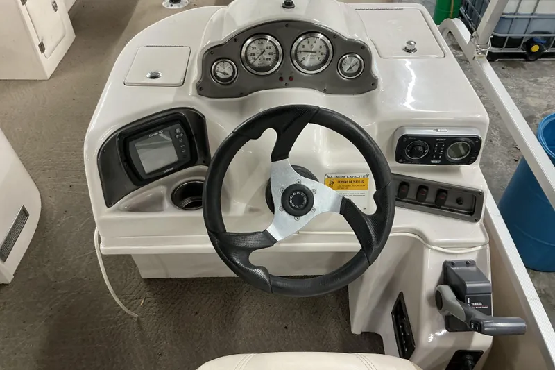 Slide: The Image of Steering console of 2008 SunCatcher LX3 26 DC boat with gauges and controls. - 6