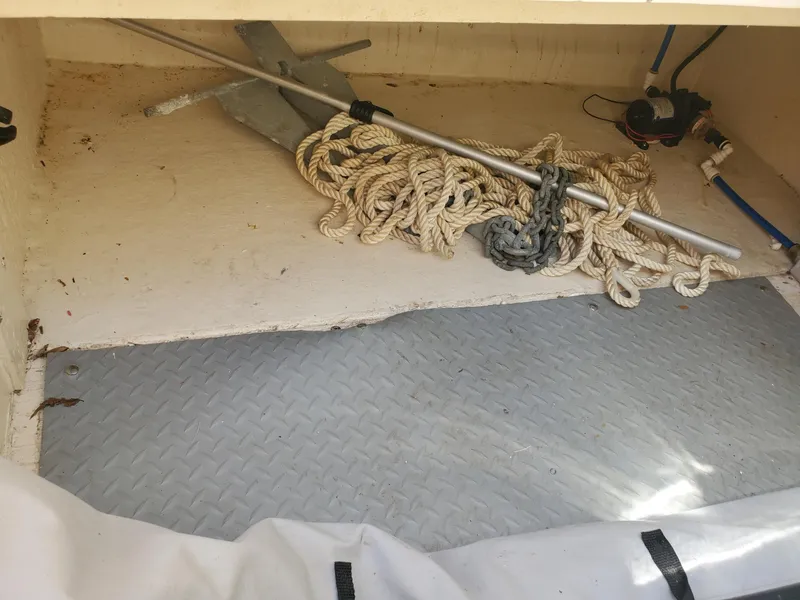 Slide: The Image of Storage compartment of a 2001 Sea Ray 245 Weekender with anchor and rope. - 14