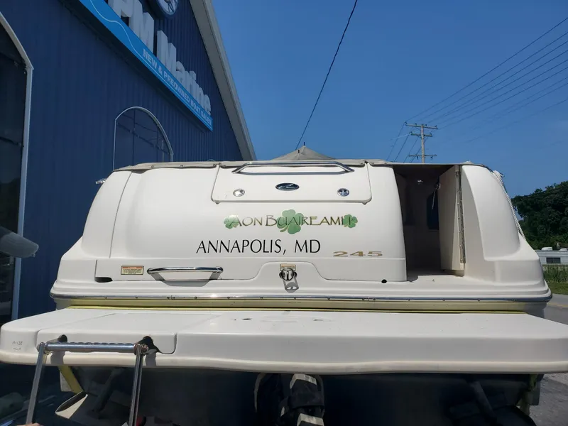 Slide: The Image of 2001 Sea Ray 245 Weekender boat docked in Annapolis, MD, near a blue building. - 8