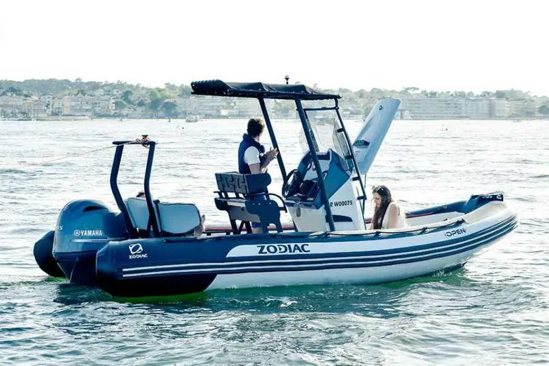 The Image of Manufacturer Provided Image: Zodiac Open 5.5 boat 2026 on water with two people. - 0
