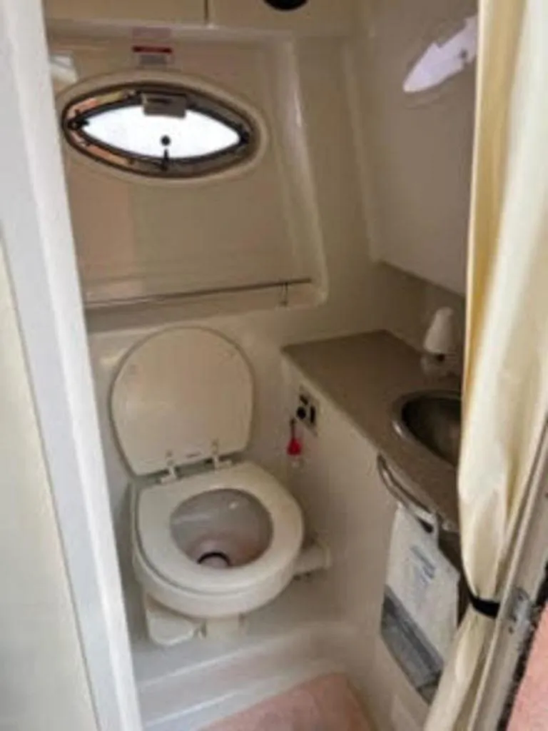 Slide: The Image of Sea Ray 290 Sundancer 2007 bathroom with toilet and sink. - 12