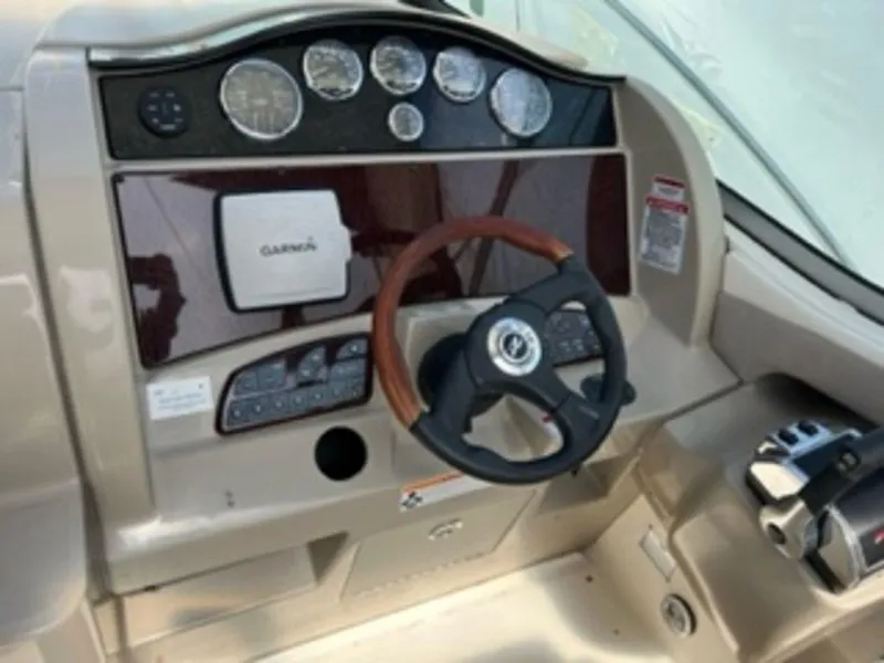 Slide: The Image of 2007 Sea Ray 290 Sundancer helm with Garmin navigation system. - 6