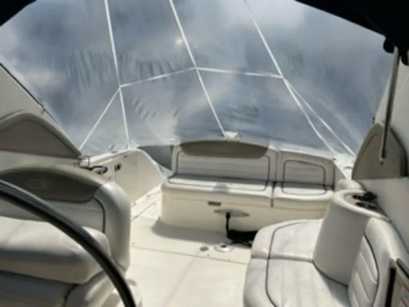 Slide: The Image of Interior of a 2007 Sea Ray 290 Sundancer with white leather seating. - 8