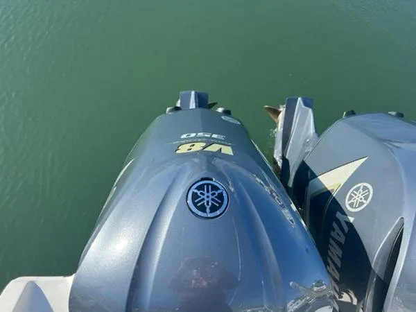 Slide: The Image of Twin Yamaha V8 outboard motors on a 2008 Spectre 34 boat, viewed from above. - 13
