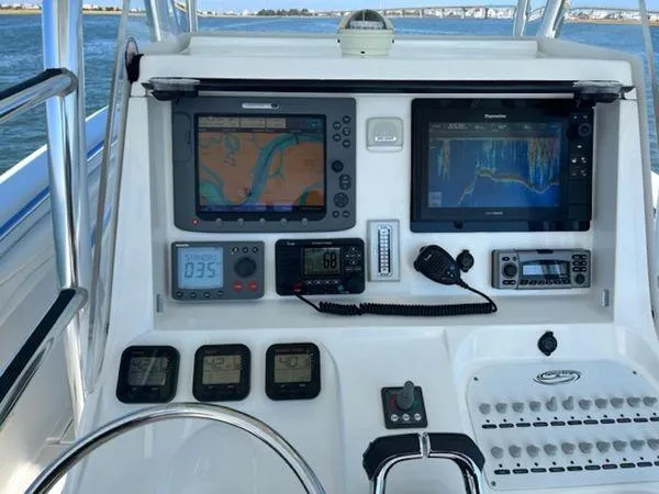 Slide: The Image of Control panel of a 2008 Spectre 34 boat with navigation and communication equipment. - 19