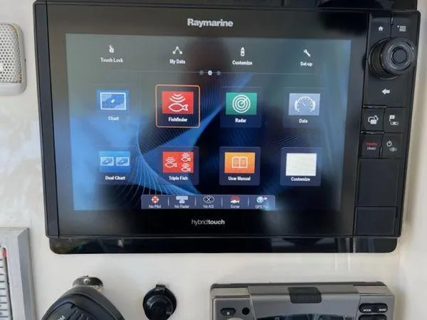Slide: The Image of Raymarine marine navigation display with fishfinder, radar, and chart options on a Spectre 34 boat. - 22