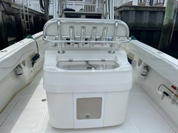 Slide: The Image of 2008 Spectre 34 boat interior with rod holders and storage compartment. - 36