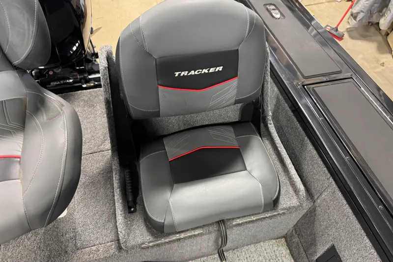 Slide: The Image of 2024 Tracker Targa V-18 Combo boat seat with gray and black upholstery. - 11