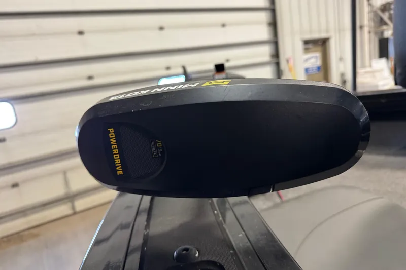 Slide: The Image of 2024 Tracker Targa V-18 Combo with Minn Kota PowerDrive motor in a garage setting. - 14